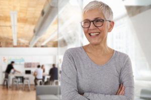 older lady smiling with dental implants