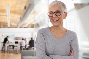 older lady smiling with dental implants 