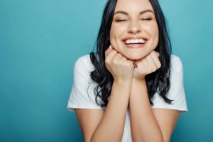 happy young woman enjoying the benefits of smiling 